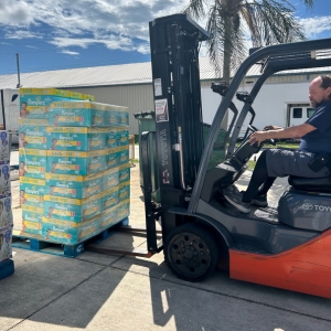 A fork lift carries diapers to moving truck for essential supplies for those in need after Hurricane Helene
