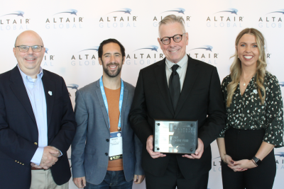 Altair and Move For Hunger representatives take photo together.